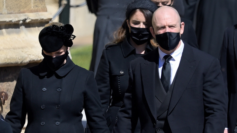 Zara and Mike Tindall walking at Prince Philip's funeral