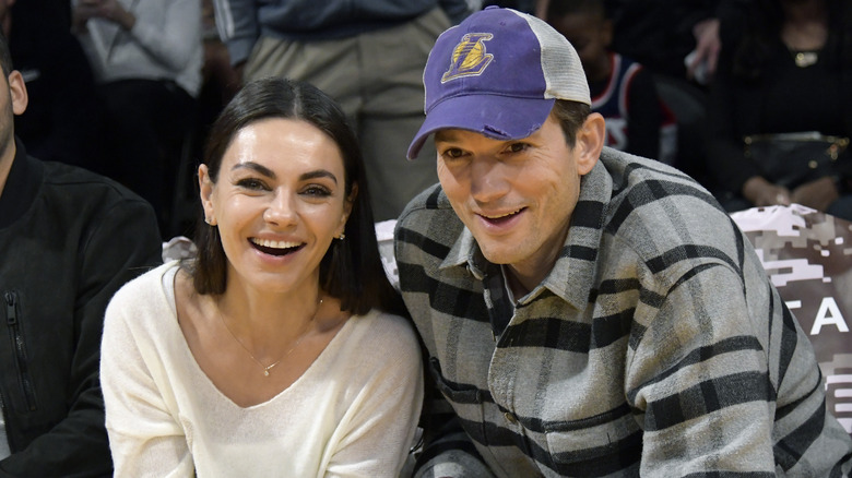 Mila Kunis and Ashton Kutcher at basketball game