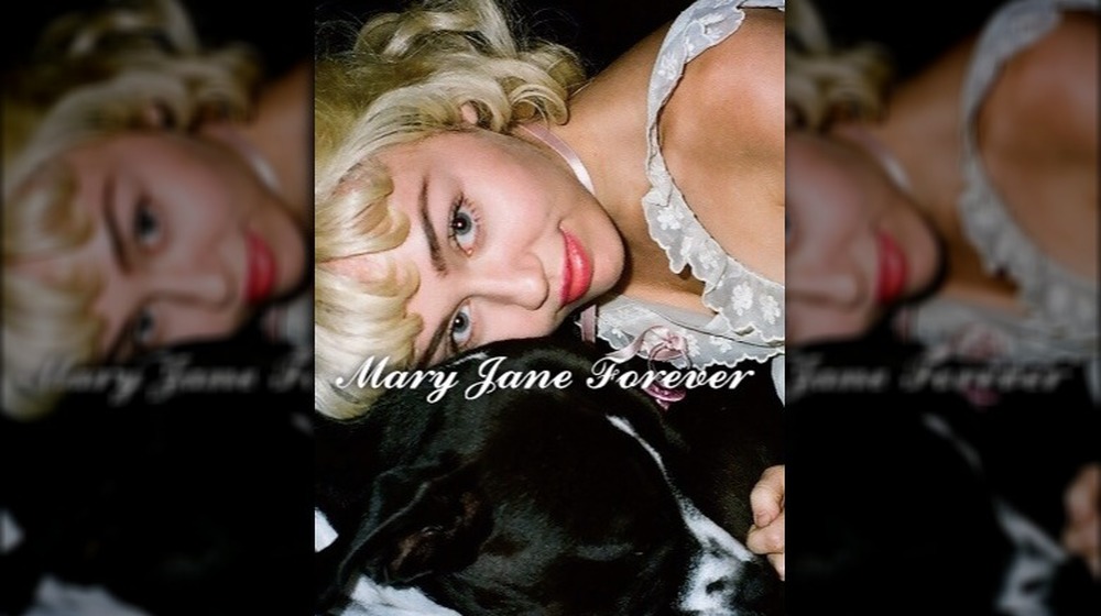 Miley Cyrus hugs dog Mary Jane