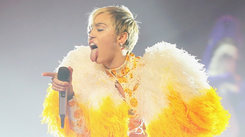 Miley Cyrus sticking her tongue out during a 'Bangerz' tour show