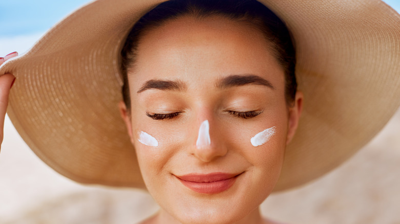 woman with sunblock on her face