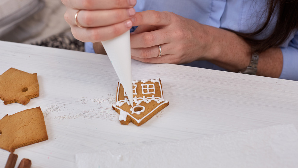 Woman decorating sugar cookies