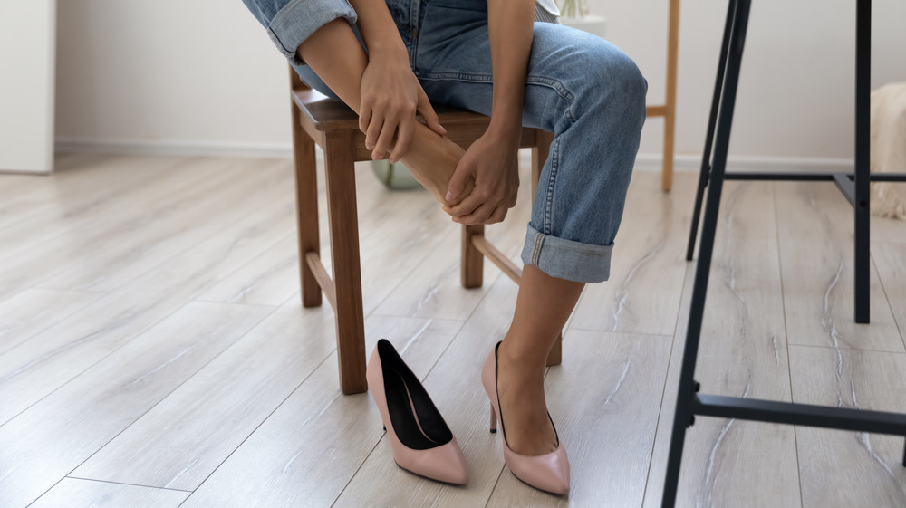 Woman rubbing her feet