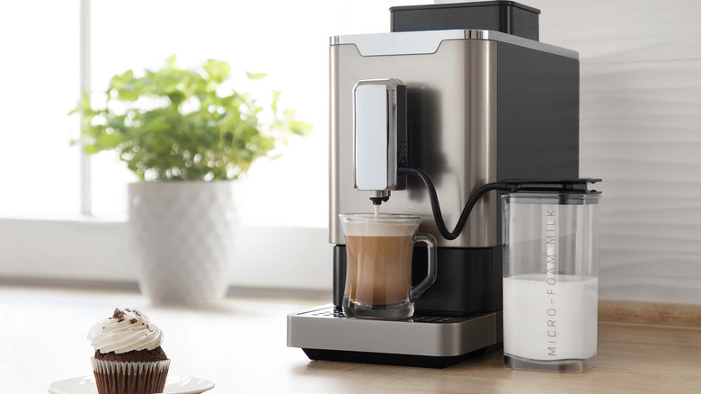 A home espresso machine making a latte