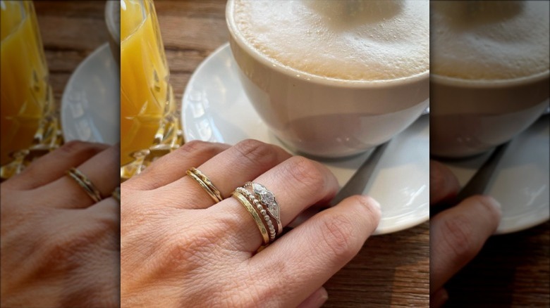 woman wearing stacking rings