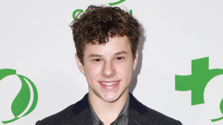 Nolan Gould smiling at the Global Green Pre-Oscar party in 2015