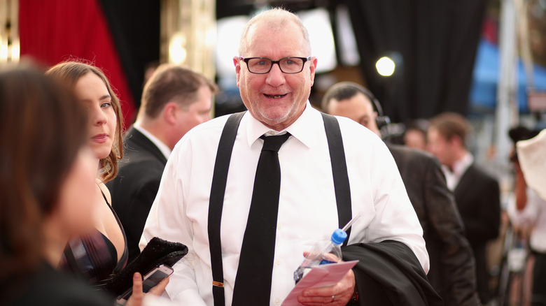 Ed O'Neill walking on a red carpet