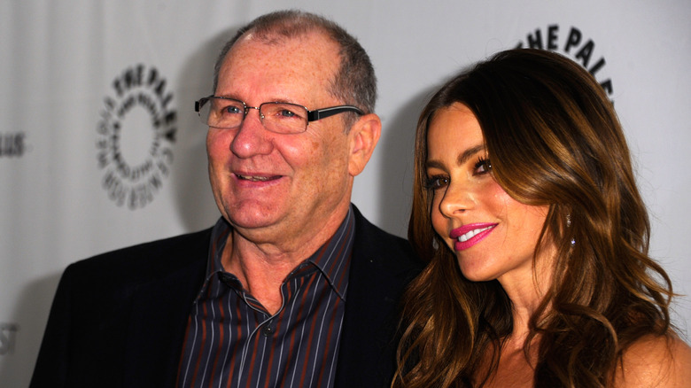 Ed O'Neill posing for photos with Sofia Vergara