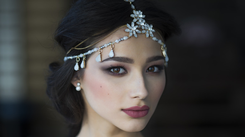 Bride wearing beaded hairpiece