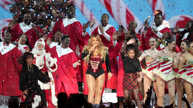 Moroccan Cannon, Mariah Carey, and Monroe Cannon on stage