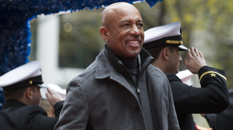 Montel Williams smiling on parade float