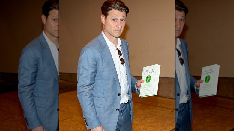 Ben McKenzie showing off his book "Easy Money" before an episode of "CBS Morning Show" in 2023