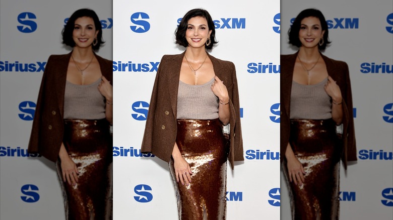 Morena Baccarin smiling for the camera at a SiriusXM event in 2024