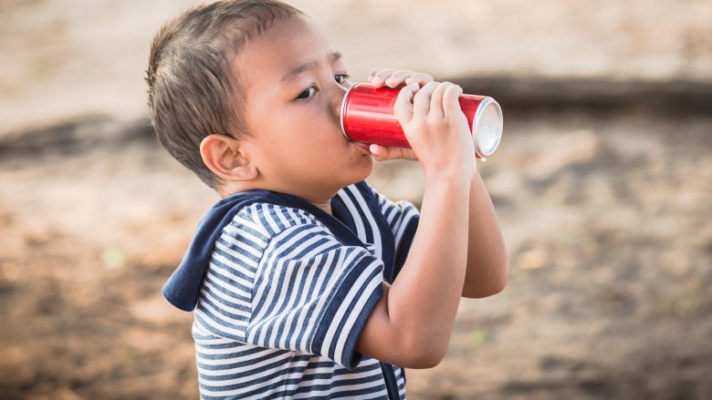 kid drinking soda