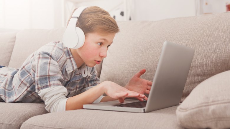 child using laptop technology