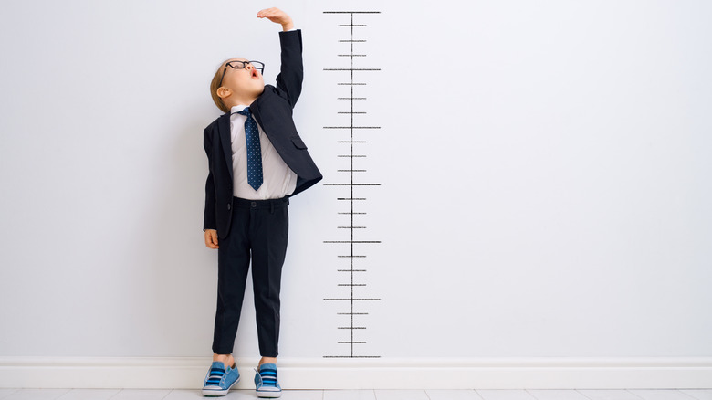 Boy having height measured