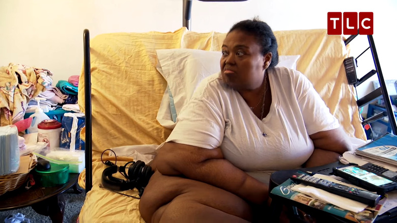 Marla McCants sitting on her bed