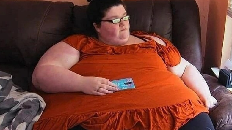 Gina Krasley sitting on couch