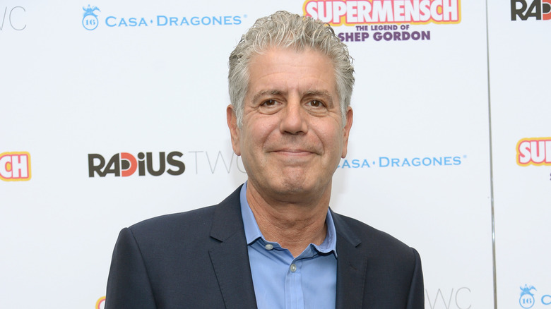 Anthony Bourdain posing at event