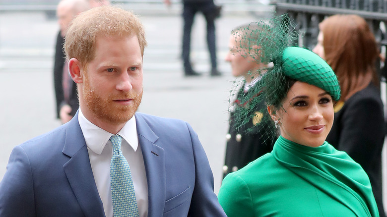 Prince Harry and Meghan Markle attending a wedding