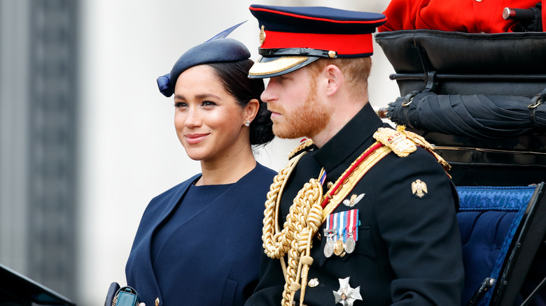 Prince Harry and Meghan Markle in a carriage in 2019