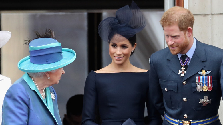 Queen Elizabeth, Meghan Markle, and Prince Harry