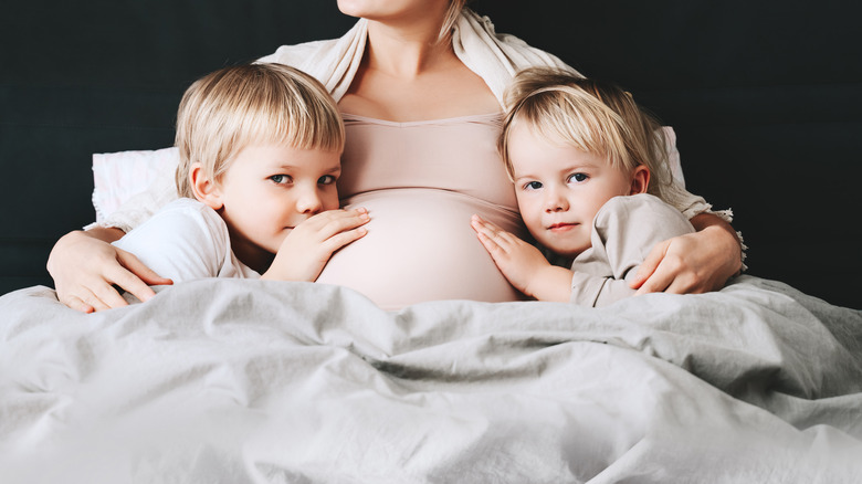 Pregnant woman with toddlers