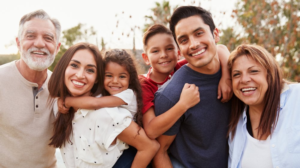 Multiple adults and children, depicting a polyamorous relationship's family