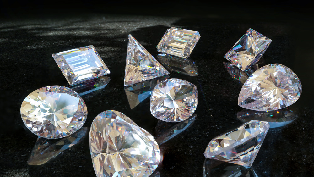 A group of diamonds on a black surface