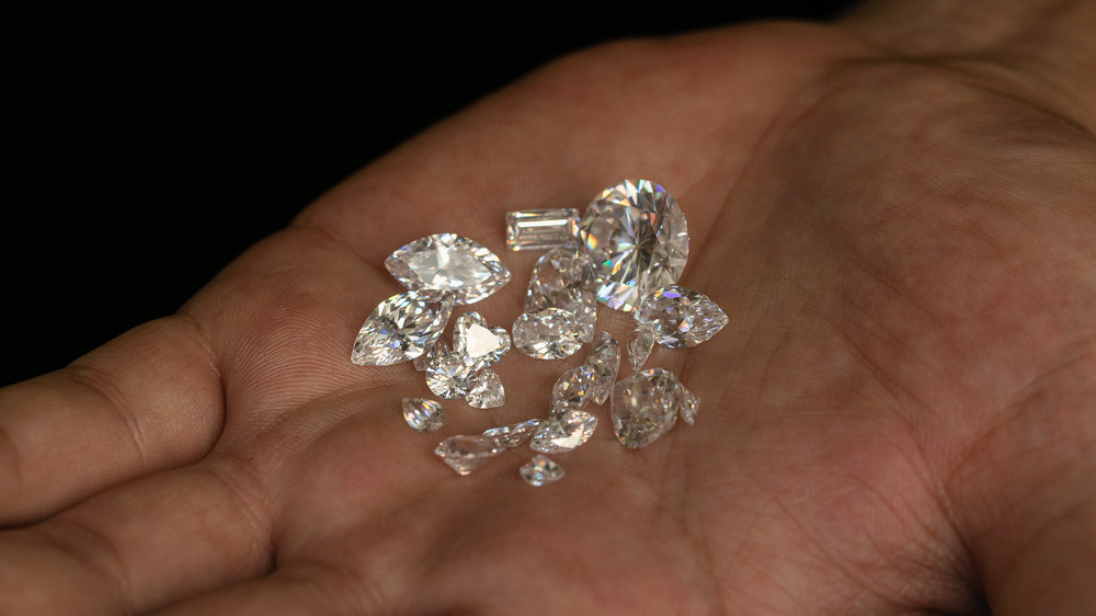 A pile of diamonds in a person's palm