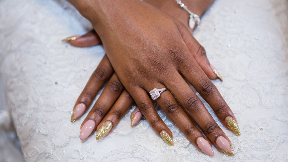 A diamond ring on a woman's hands