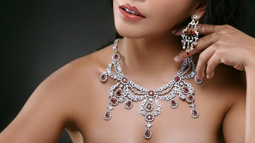 Woman wearing ruby and diamond jewelry 