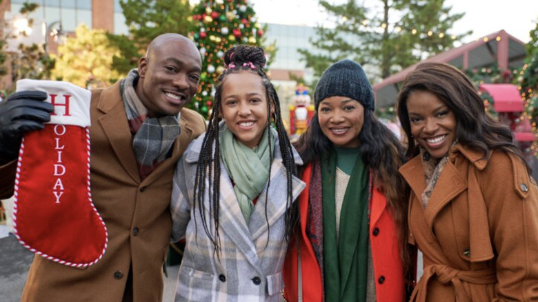 R.J. and sisters on set of The Holiday Stocking