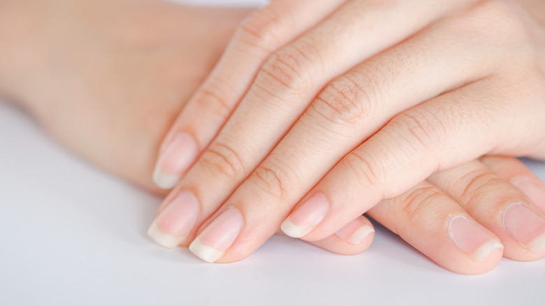 Hands with unpainted nails