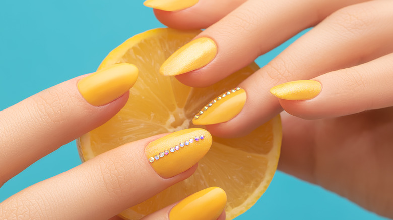 Yellow nails with jewels 