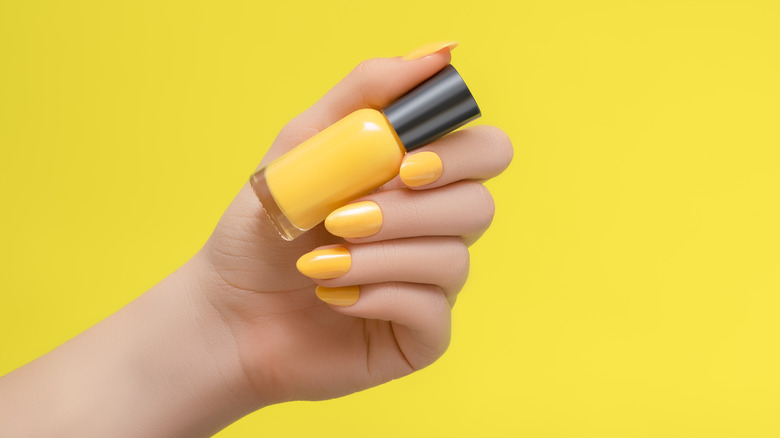 Yellow nail polish manicure