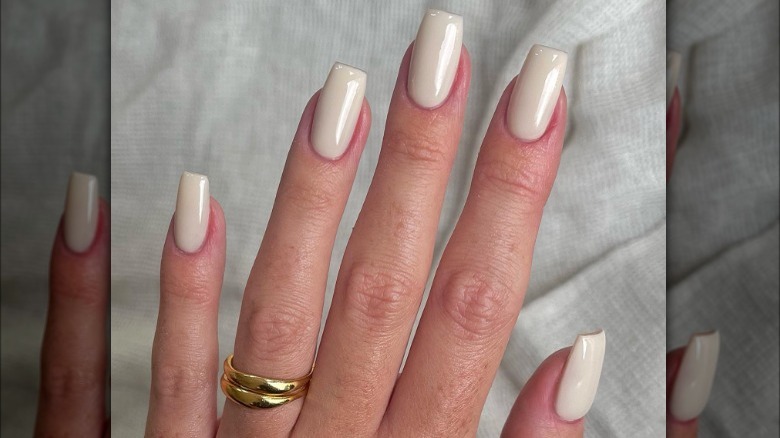 hand with cream nails