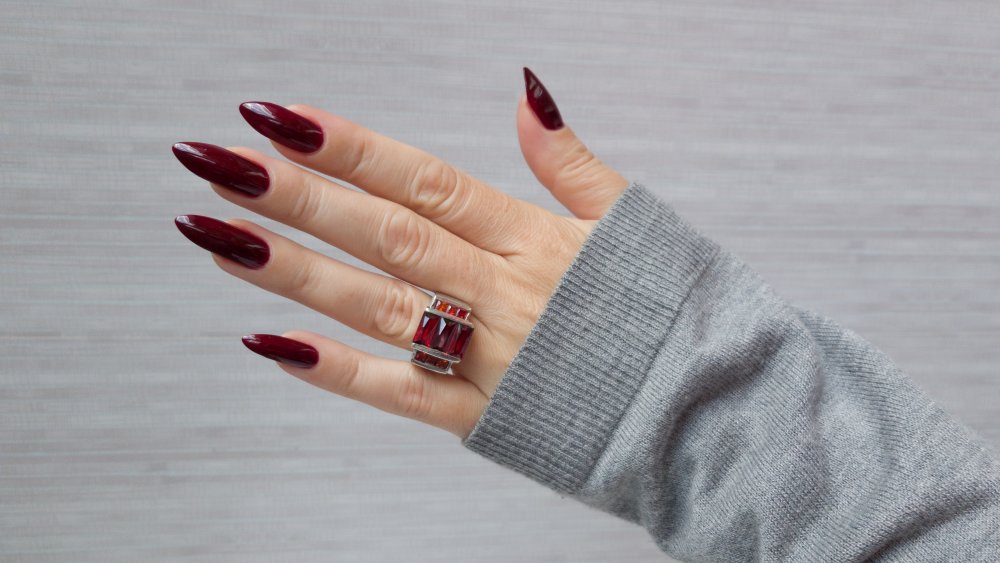 Almond shaped nails in dark red, a 2020 nail trend