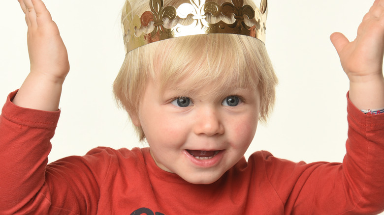 Baby boy wearing crown