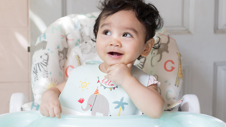 Baby happily looking up