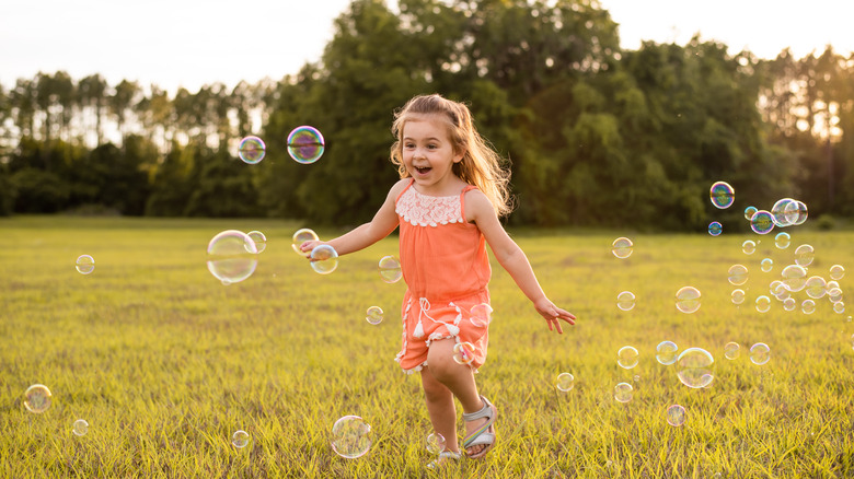 A child running through a field 