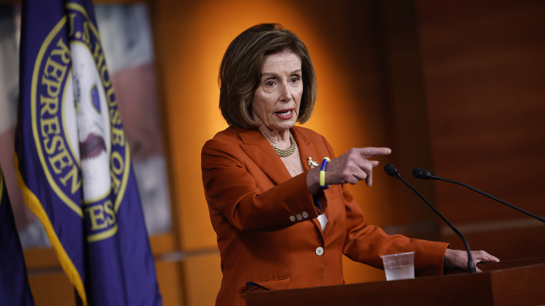 Nancy Pelosi pointing from the podium