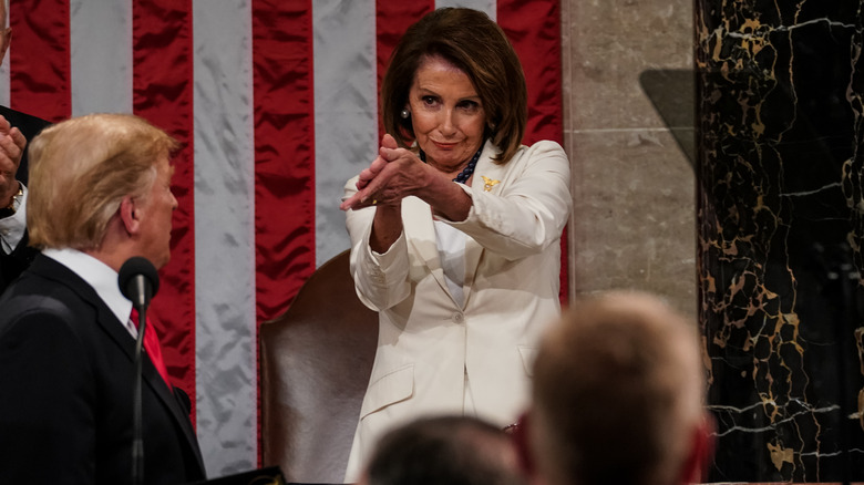 Nancy Pelosi clapping to Donald Trump 