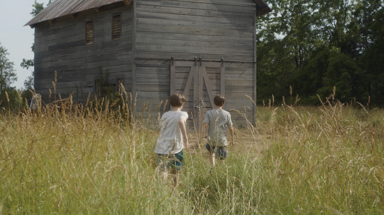 The twins investigating the barn