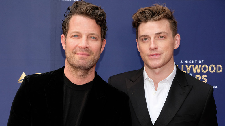 Nate Berkus and Jeremiah Brent in black suits