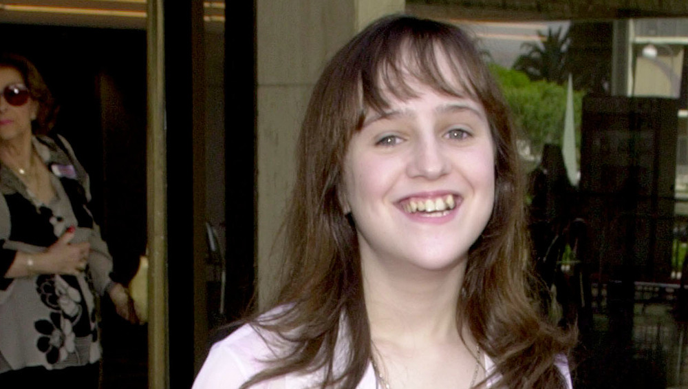 Mara Wilson smiling as a young woman