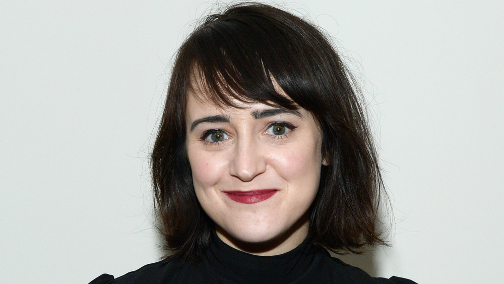 Mara Wilson wearing black and a red lip