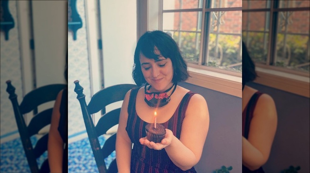 Mara Wilson blowing out candle