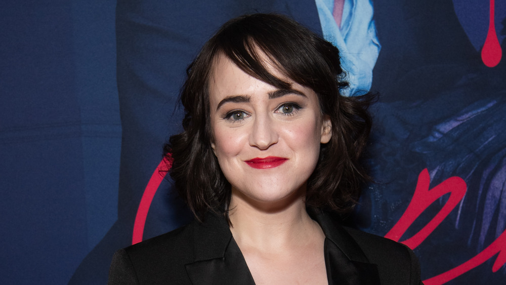 Mara Wilson wearing a black dress