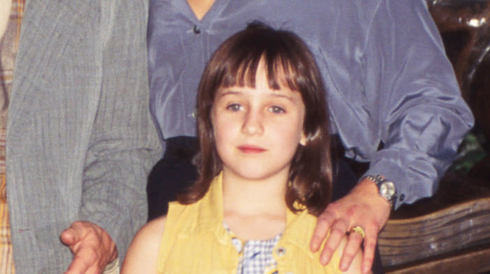 Mara Wilson wearing a yellow vest